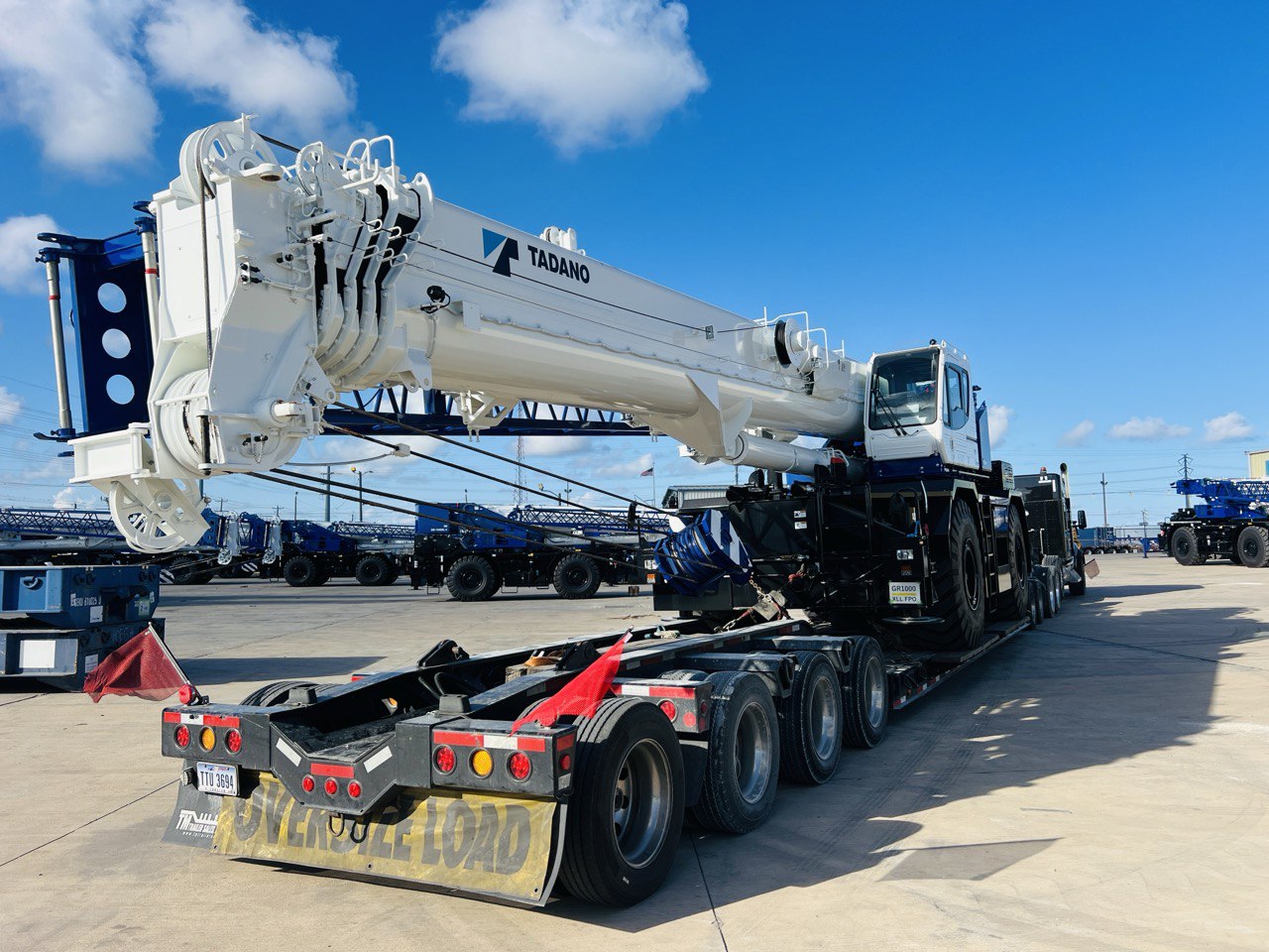 Tadano all-terrain crane secured on a multi-axle lowboy trailer